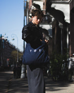 Person with small tote bag