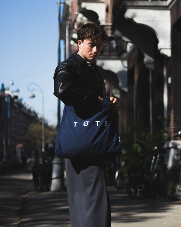 Customer with tote bag outdoors