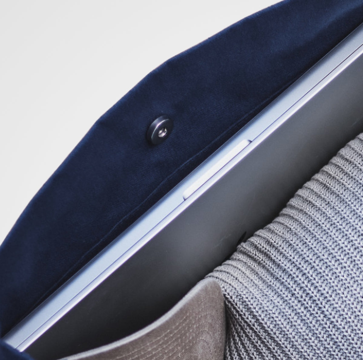 The Wide-Strap TOTE Bag laptop compartment, with a laptop in its own slot against the back panel